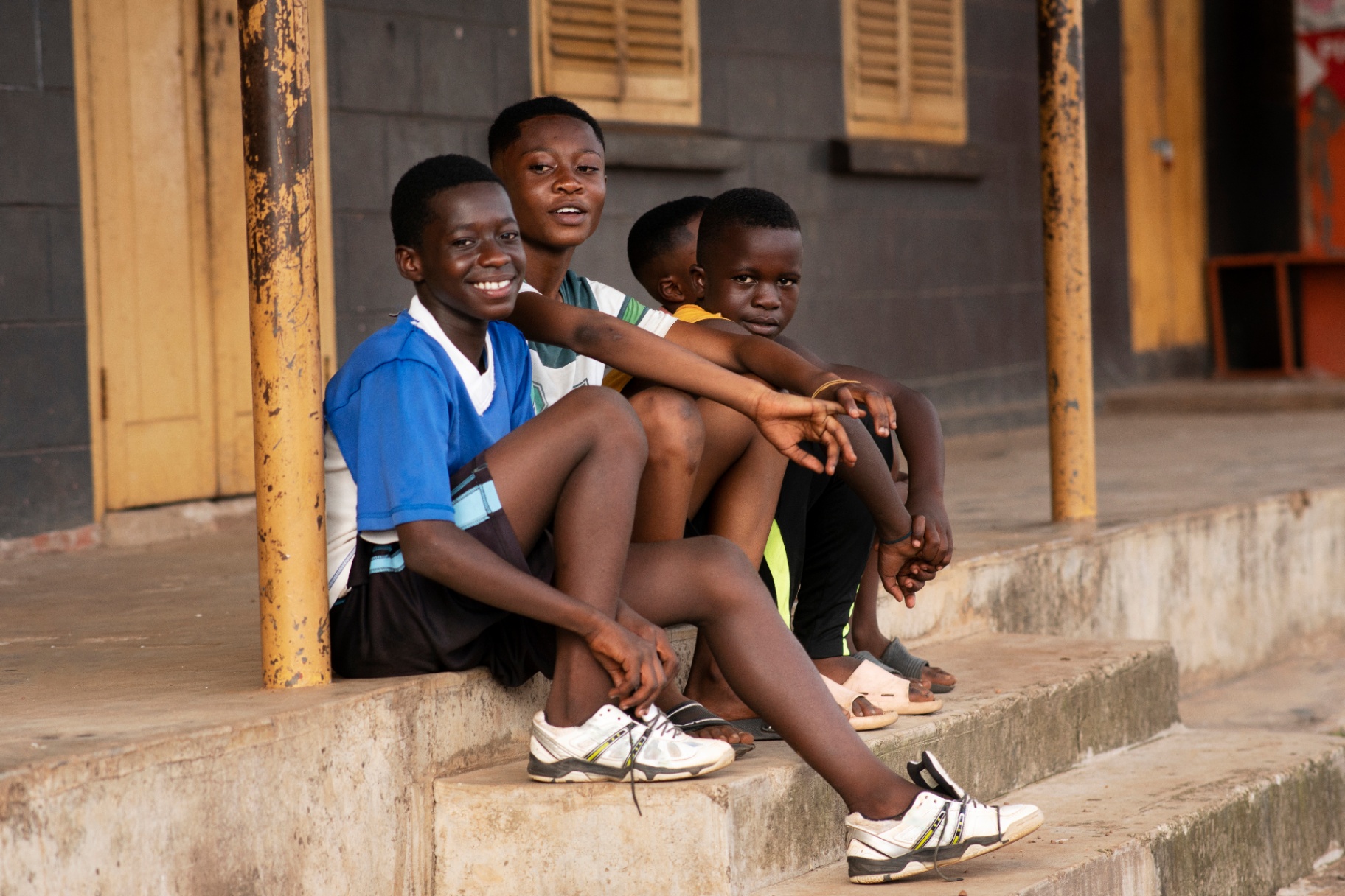 Children sitting together on steps